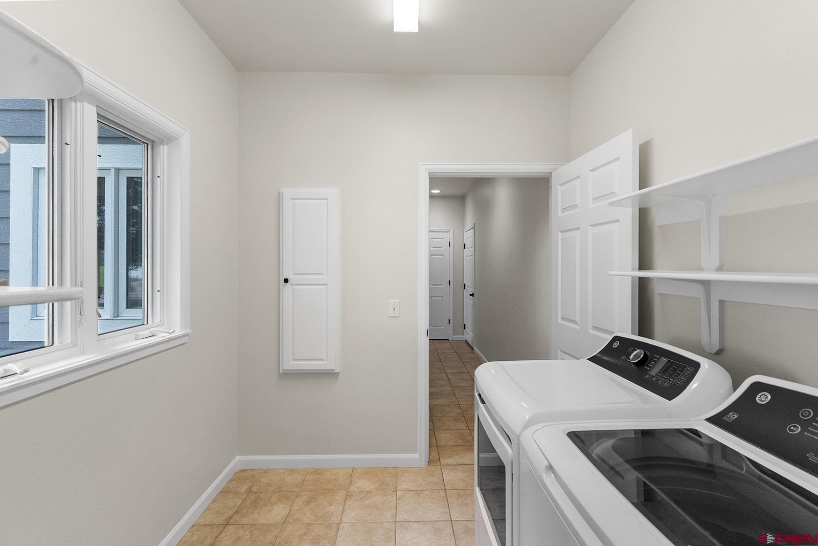 66356 Otter Road Montrose, CO 81403 - Photo 28 of 45 a view of a bathroom with a sink and washing machine