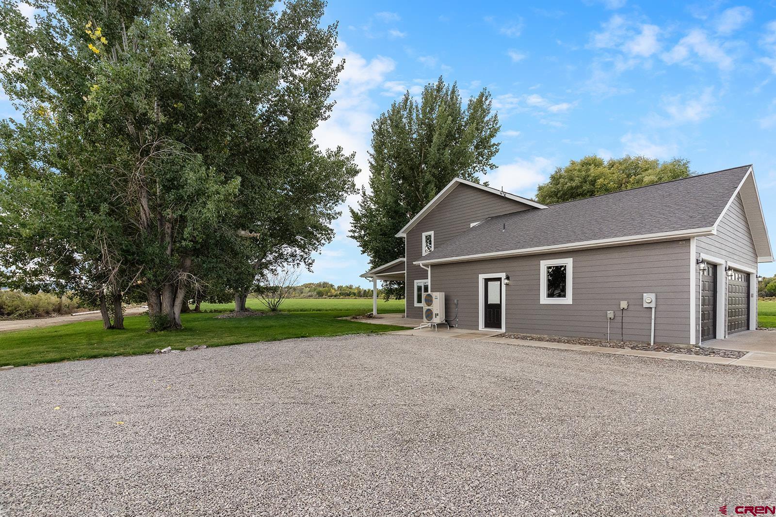 66356 Otter Road Montrose, CO 81403 - Photo 33 of 45 a front view of house with yard and green space