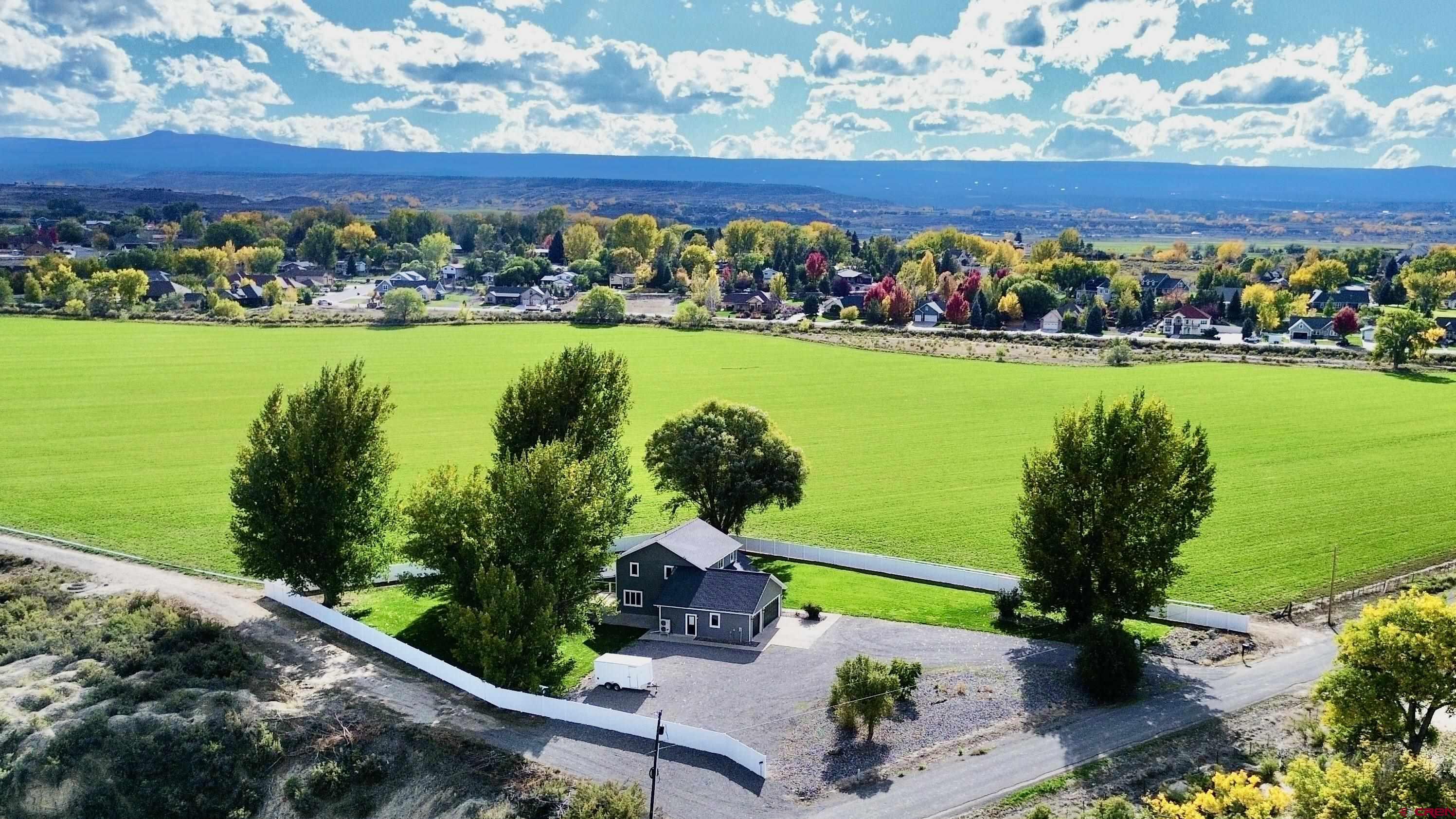 66356 Otter Road Montrose, CO 81403 - Photo 35 of 45 a view of a lake with a building in the background