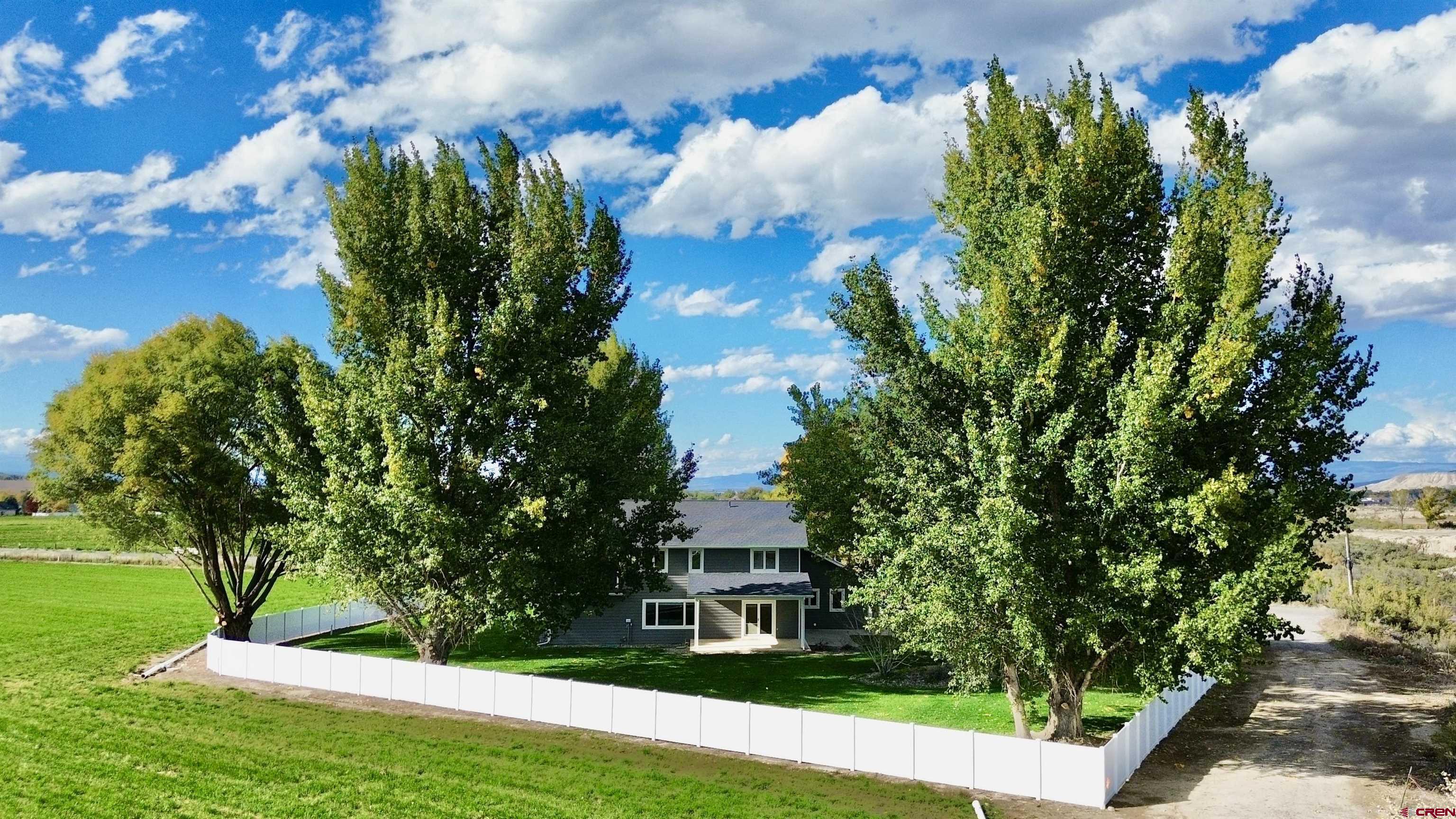 66356 Otter Road Montrose, CO 81403 - Photo 40 of 45 a front view of a house with a yard and a garden