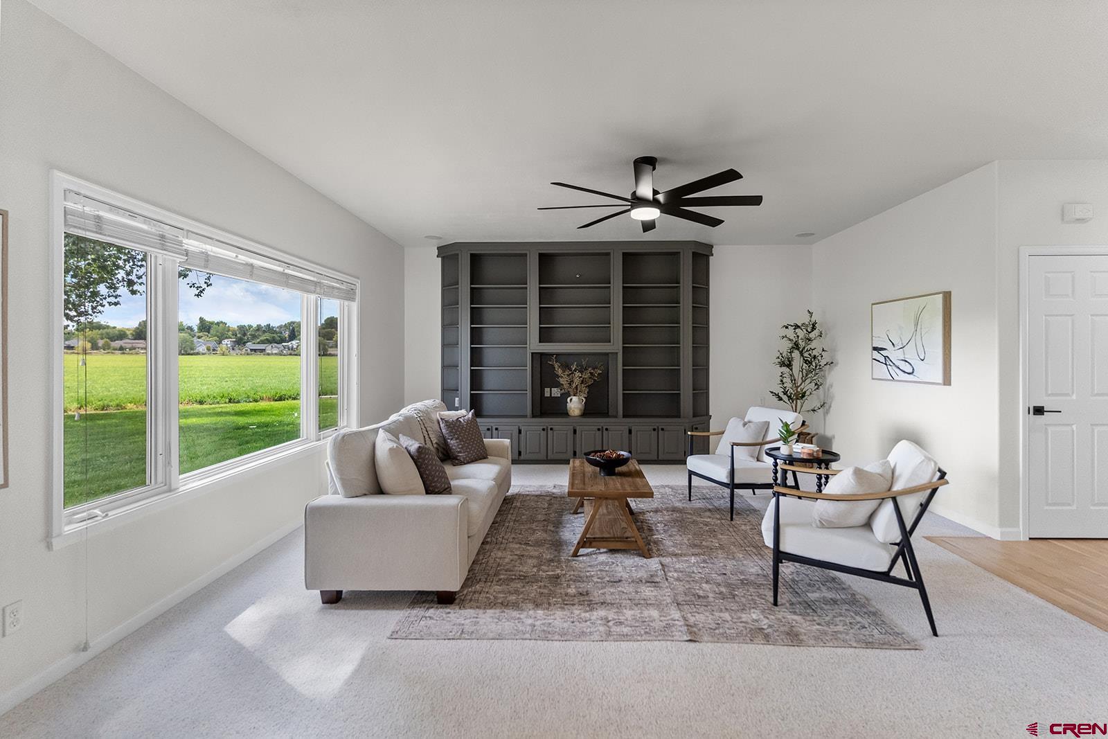 66356 Otter Road Montrose, CO 81403 - Photo 4 of 45 a living room with furniture and a large window