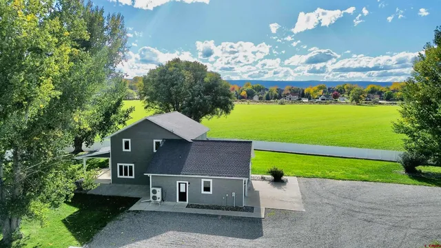 swimming pool view with a garden
