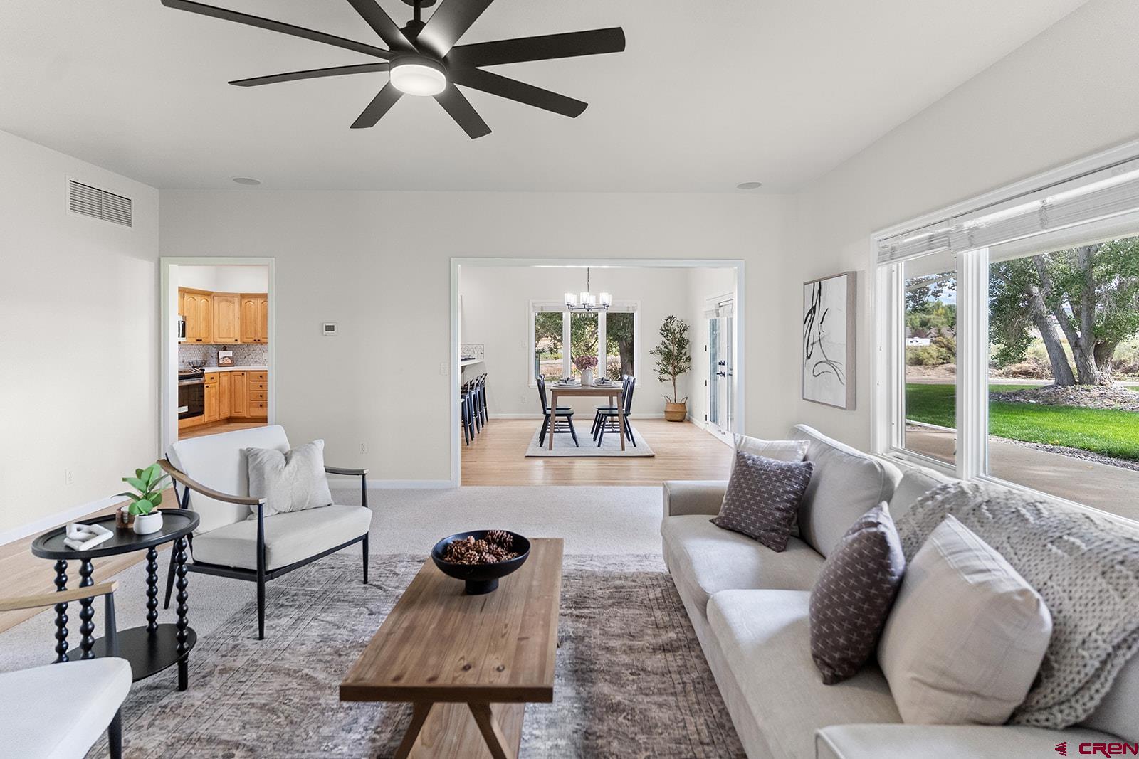 66356 Otter Road Montrose, CO 81403 - Photo 5 of 45 a living room with furniture and a large window