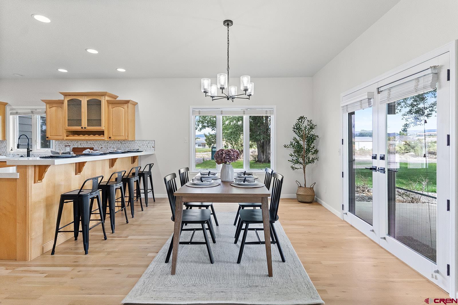 66356 Otter Road Montrose, CO 81403 - Photo 6 of 45 a view of a dining room with furniture window and wooden floor