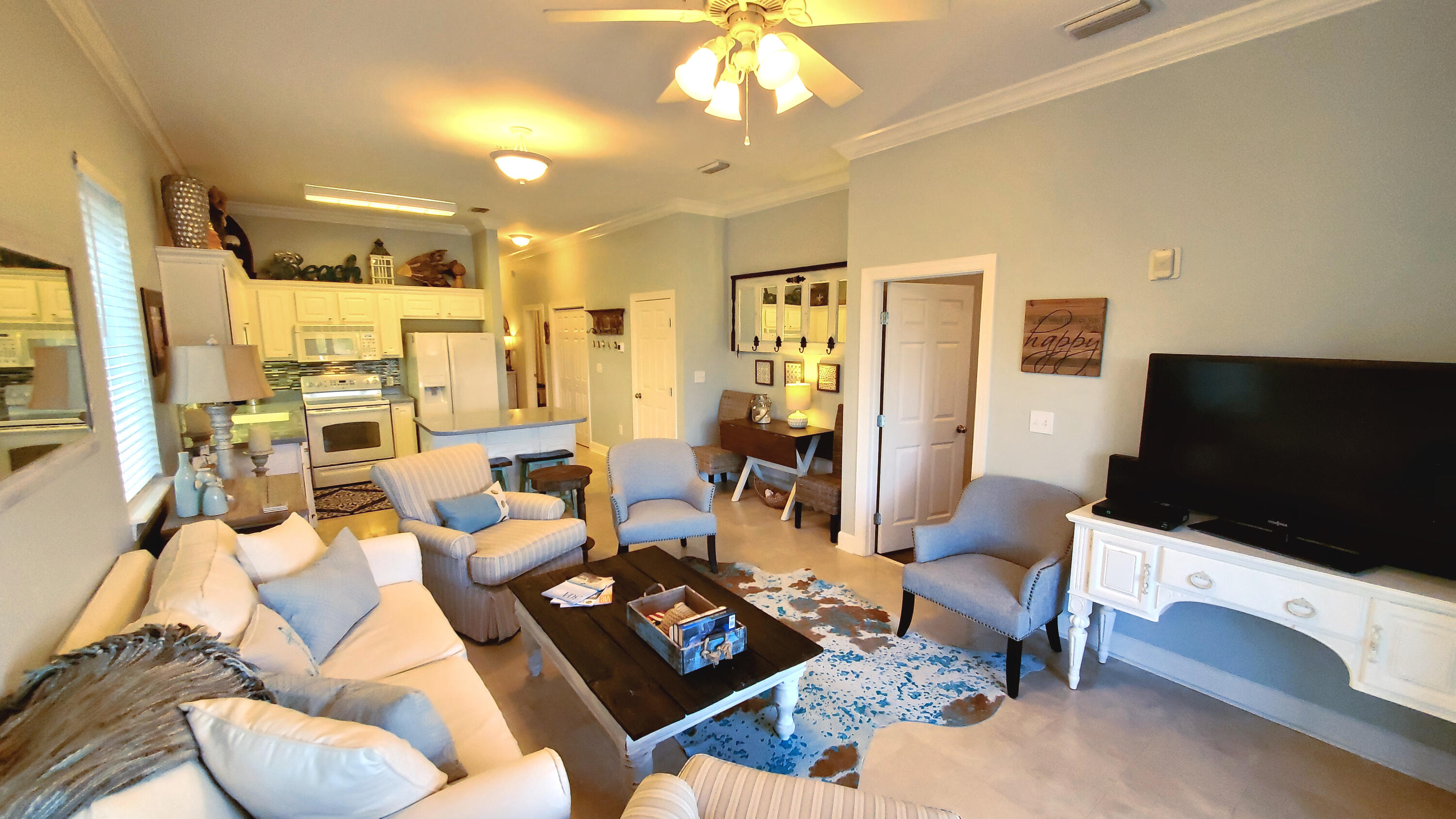 231 Somerset Bridge Road, Unit 2206 Santa Rosa Beach, FL 32459 - Photo 3 of 23 a living room with furniture and a flat screen tv