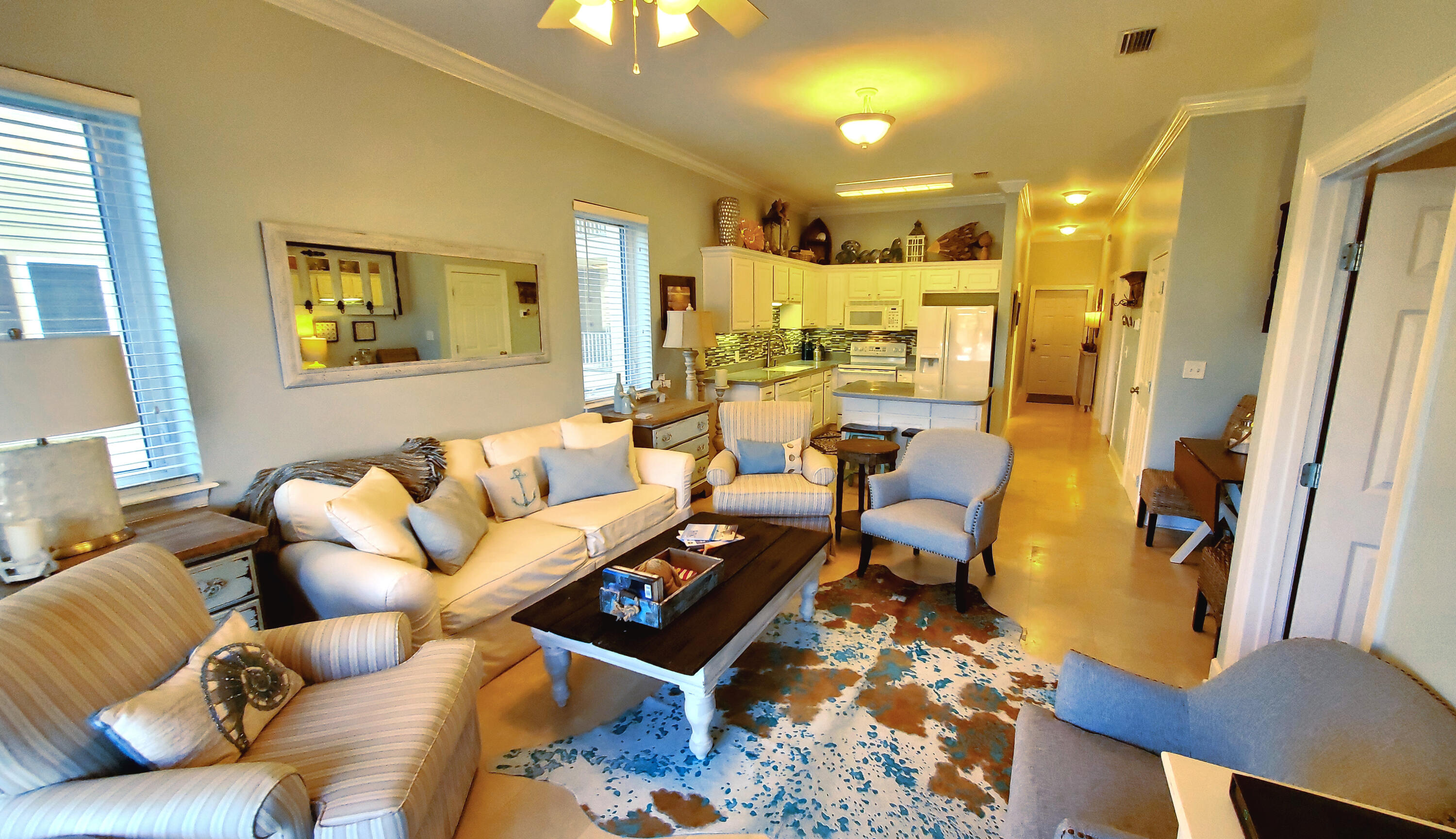 231 Somerset Bridge Road, Unit 2206 Santa Rosa Beach, FL 32459 - Photo 4 of 23 a living room with furniture and a chandelier