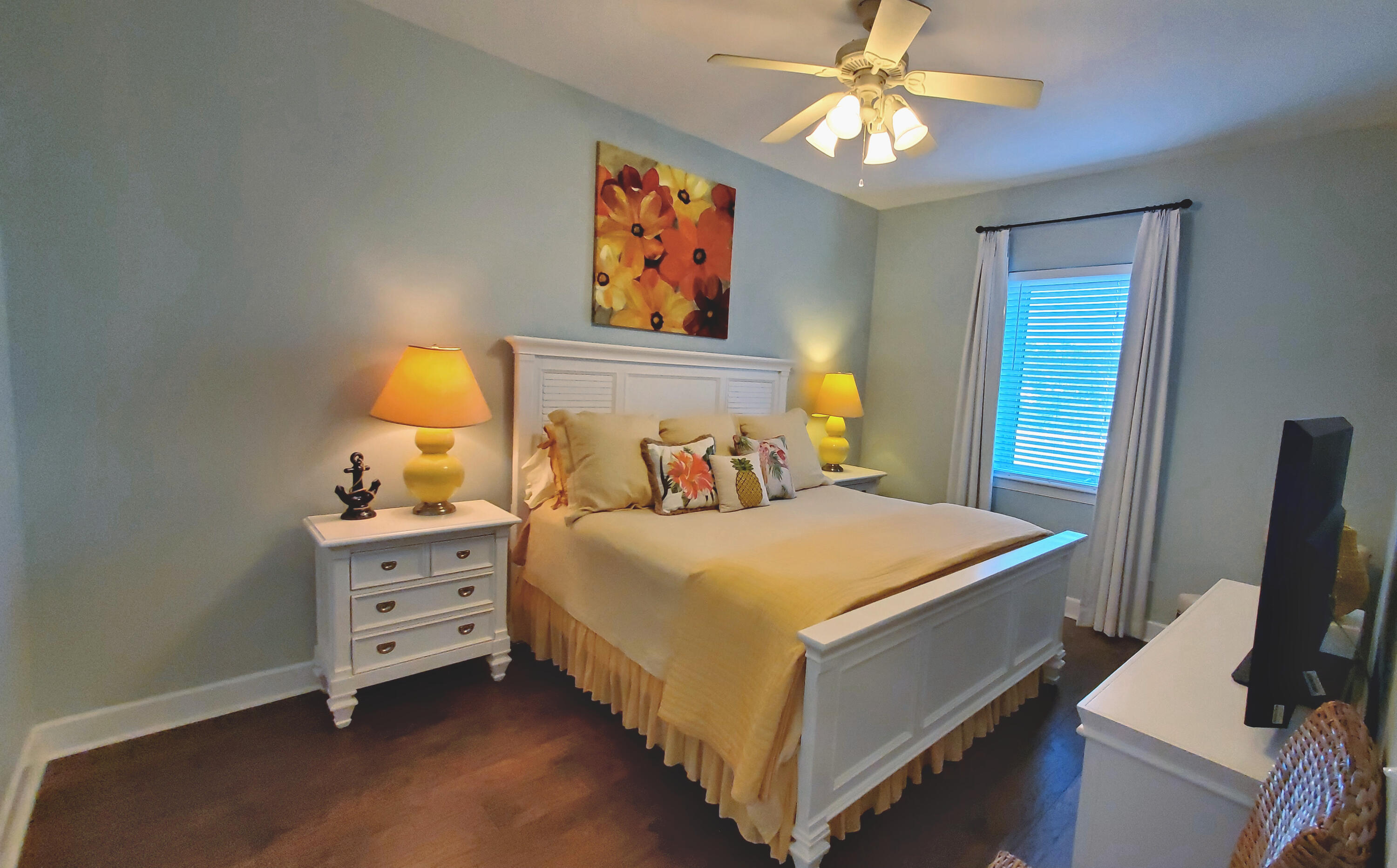 231 Somerset Bridge Road, Unit 2206 Santa Rosa Beach, FL 32459 - Photo 9 of 23 a bedroom with a bed and a chandelier