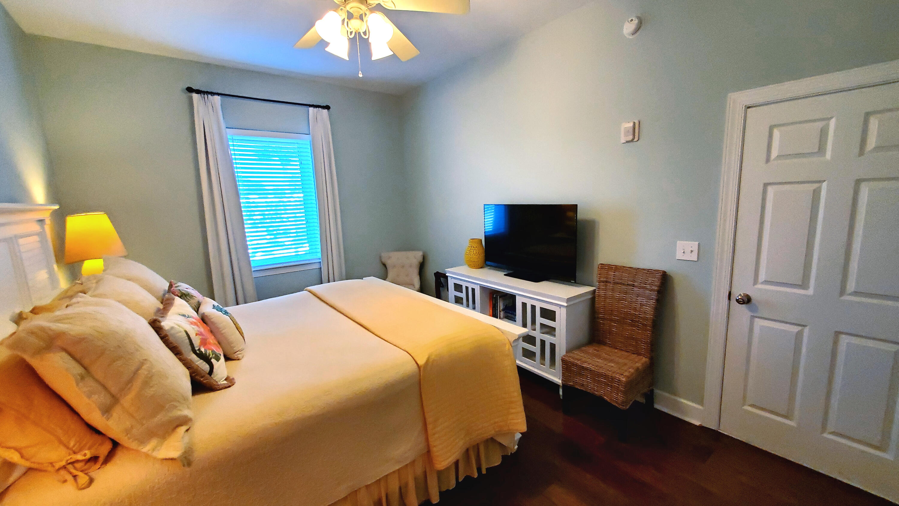 231 Somerset Bridge Road, Unit 2206 Santa Rosa Beach, FL 32459 - Photo 10 of 23 a bedroom with a bed and wooden floor