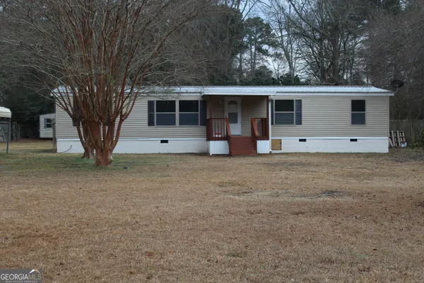 a house with trees in the background