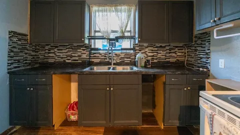 a view of gallery with wooden floor