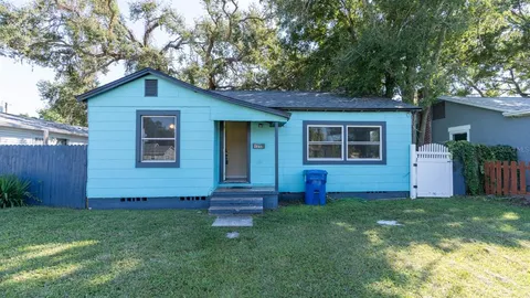 a view of a house with swimming pool and porch