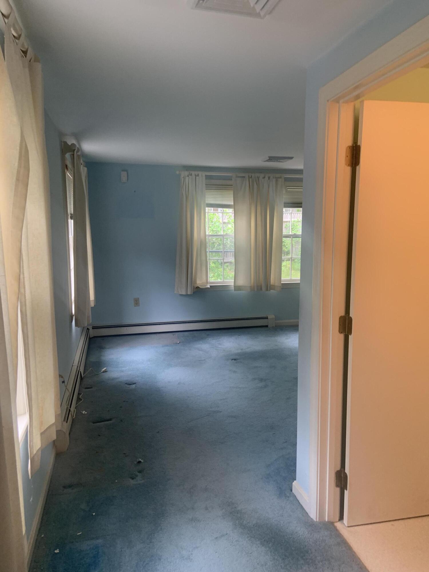 121 Longfellow Drive Centerville, MA 02632 - Photo 13 of 15 an empty room with windows