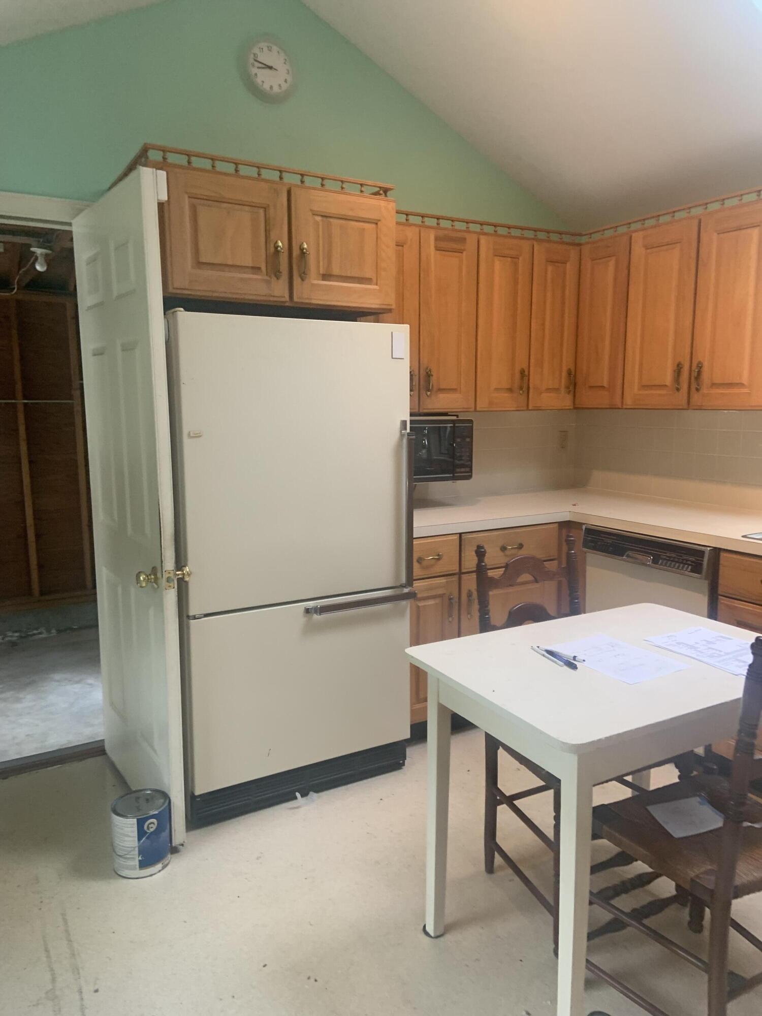121 Longfellow Drive Centerville, MA 02632 - Photo 2 of 15 a white refrigerator freezer sitting in a kitchen