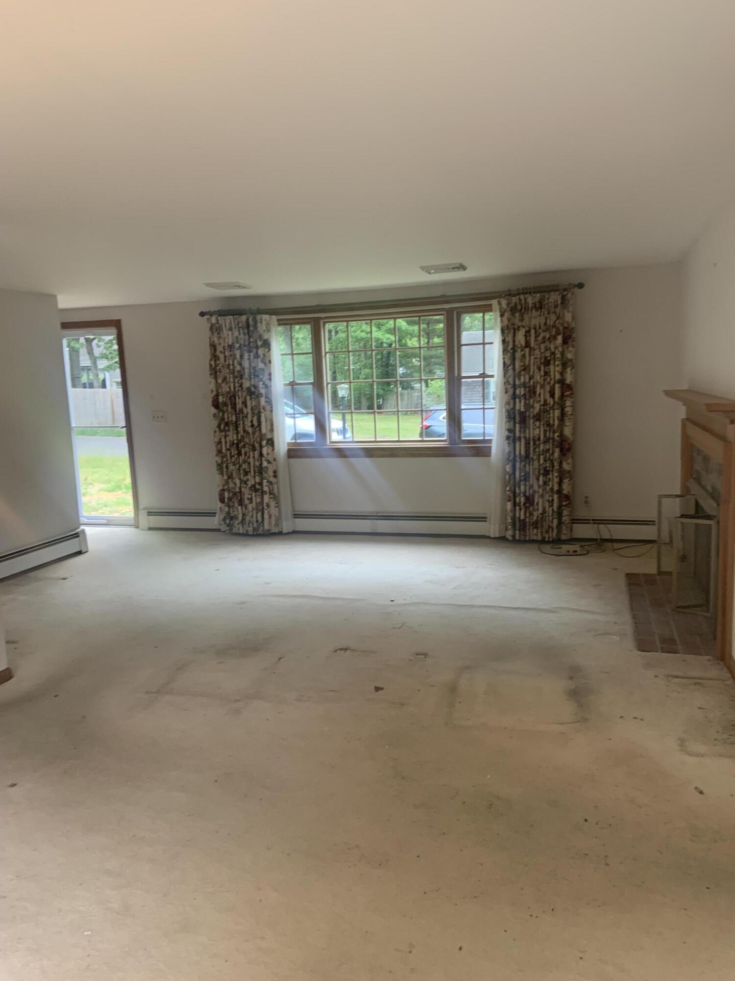 121 Longfellow Drive Centerville, MA 02632 - Photo 5 of 15 an empty room with windows