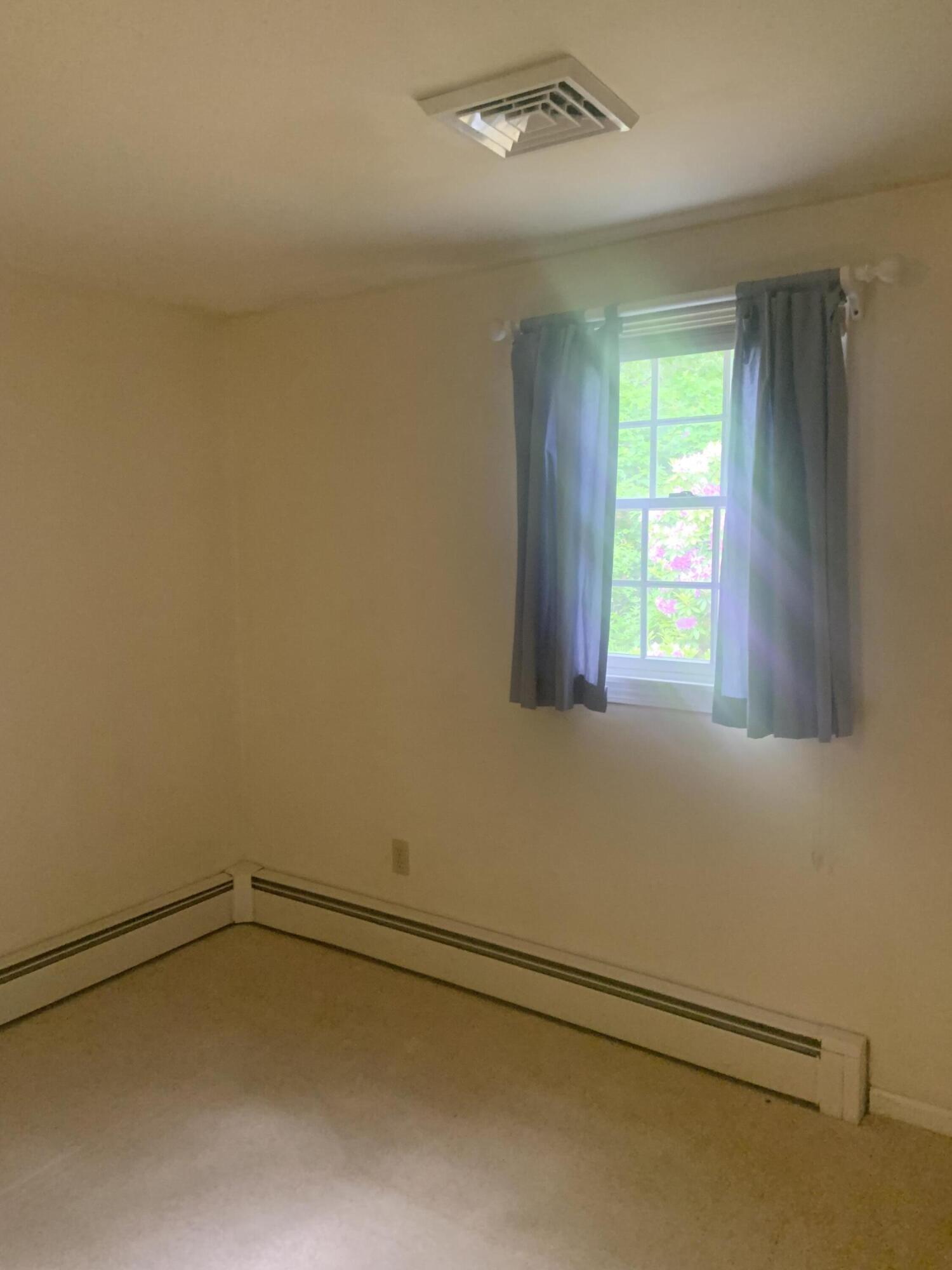 121 Longfellow Drive Centerville, MA 02632 - Photo 10 of 15 a view of an empty room and a window