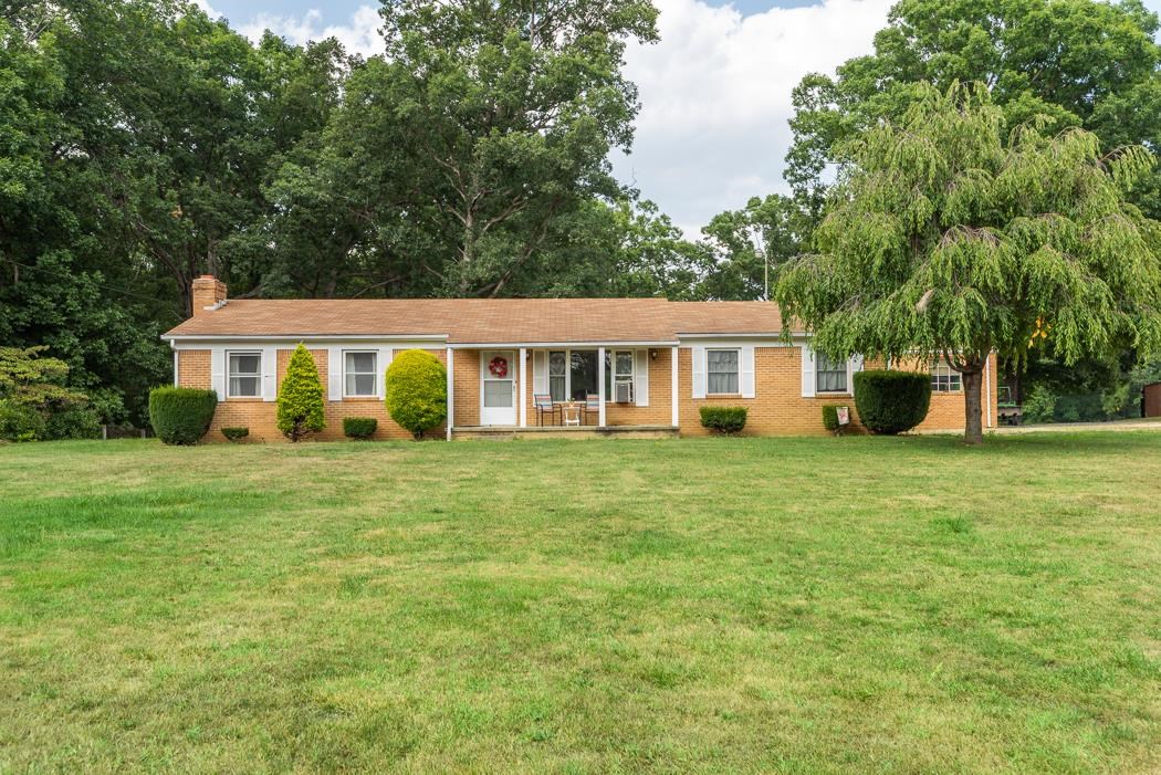 550 Dooms Crossing Road Waynesboro, VA 22980 - Photo 1 of 41 a front view of a house with a garden