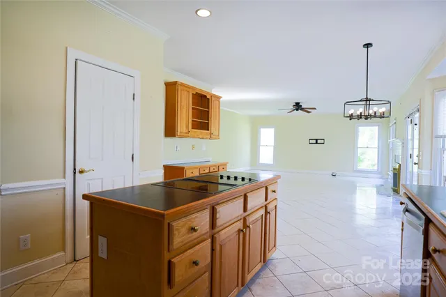 a kitchen that has a sink and a stove in it