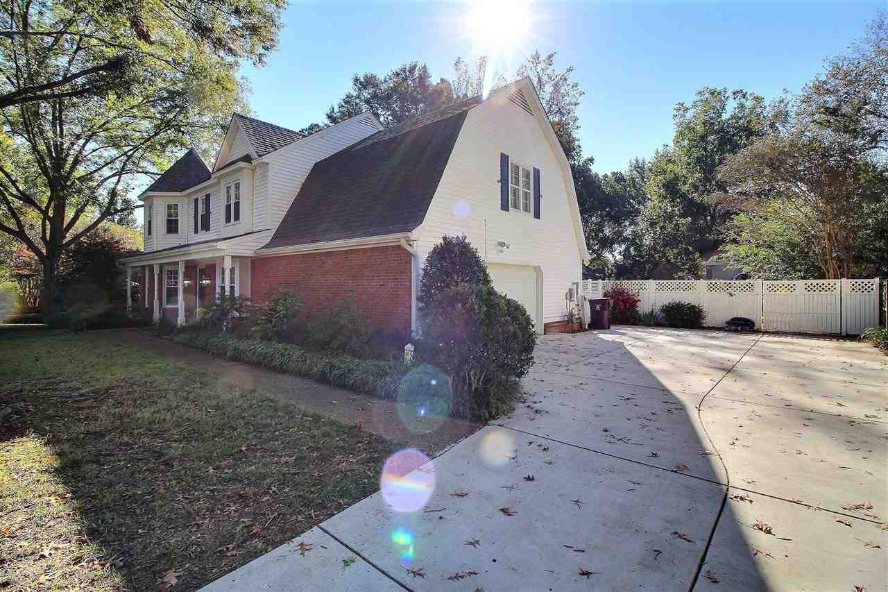 431 King Ridge Drive Collierville, TN 38017 - Photo 2 of 25 a view of a white house with a yard