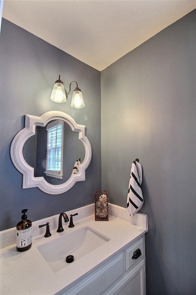 431 King Ridge Drive Collierville, TN 38017 - Photo 14 of 25 a bathroom with a sink and a mirror