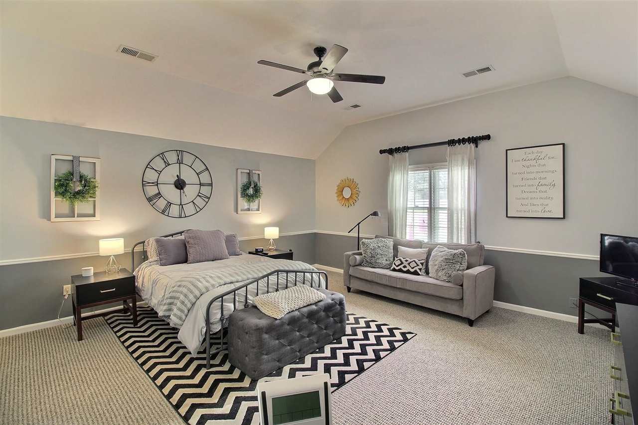431 King Ridge Drive Collierville, TN 38017 - Photo 15 of 25 a bedroom with a bed and a couch