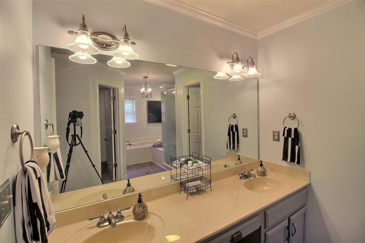 431 King Ridge Drive Collierville, TN 38017 - Photo 16 of 25 a bathroom with a double vanity sink and a mirror