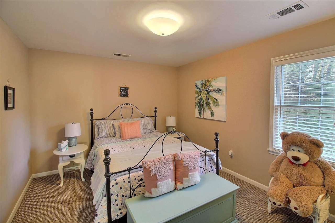 431 King Ridge Drive Collierville, TN 38017 - Photo 20 of 25 a bedroom with a bed and wooden floor