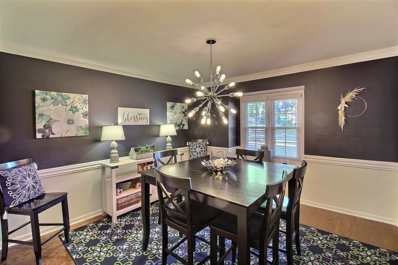 431 King Ridge Drive Collierville, TN 38017 - Photo 7 of 25 a dining room with a wooden table and chairs