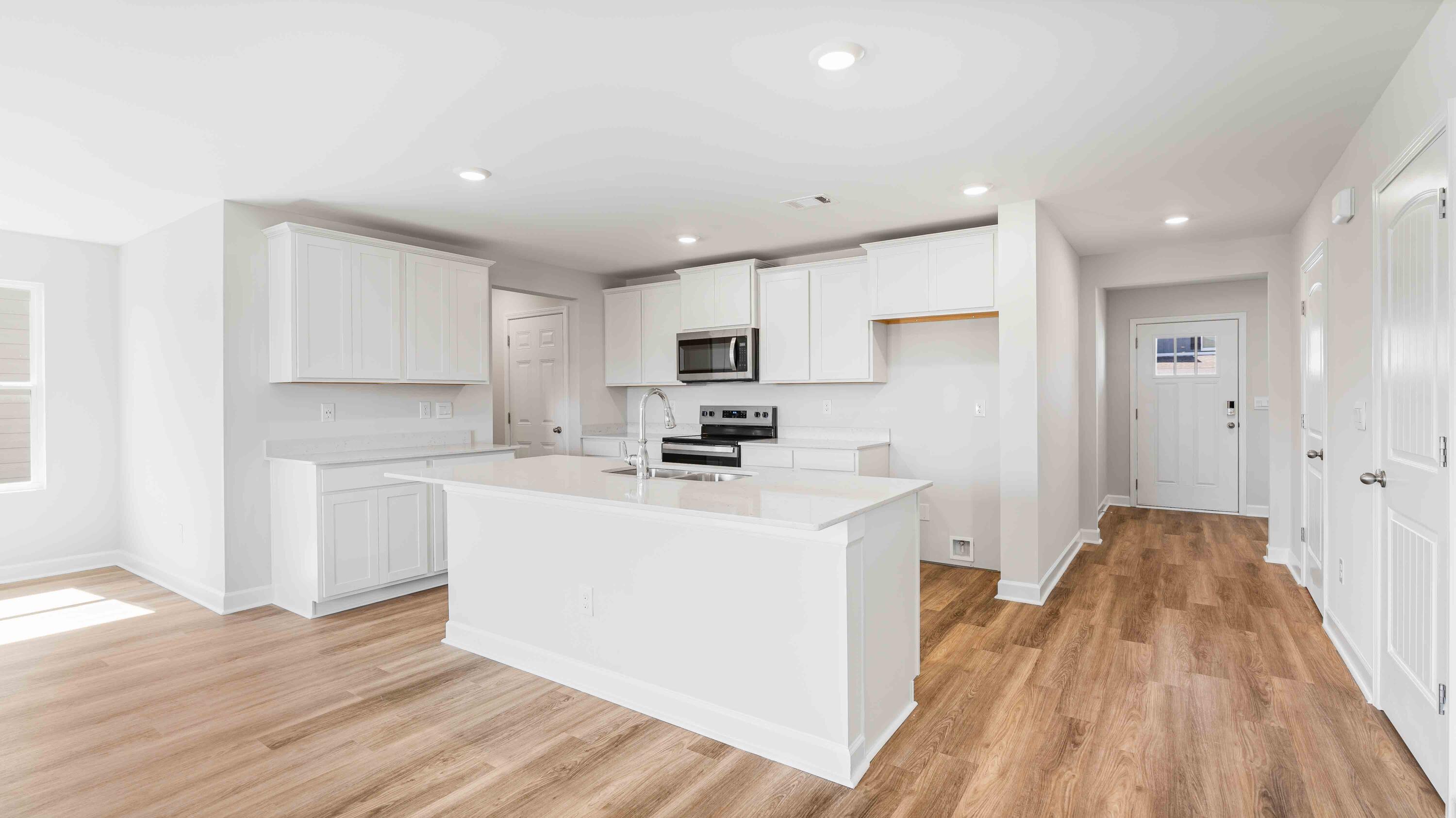 4611 Soldier Court Crestview, FL 32539 - Photo 2 of 14 a kitchen with a sink a refrigerator and cabinets