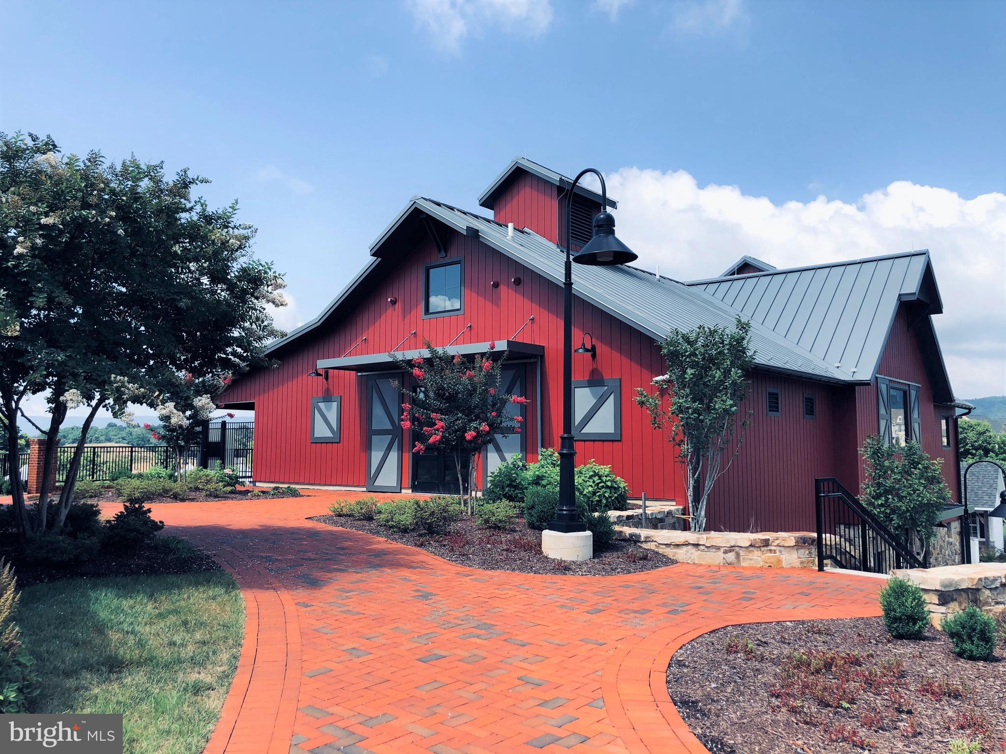 1414 Musgrove Alley Brunswick, MD 21716 - Photo 60 of 64 a front view of a house with a yard