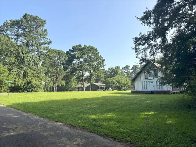 a view of grassy field with trees