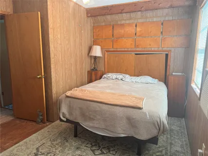 a view of a park with large trees