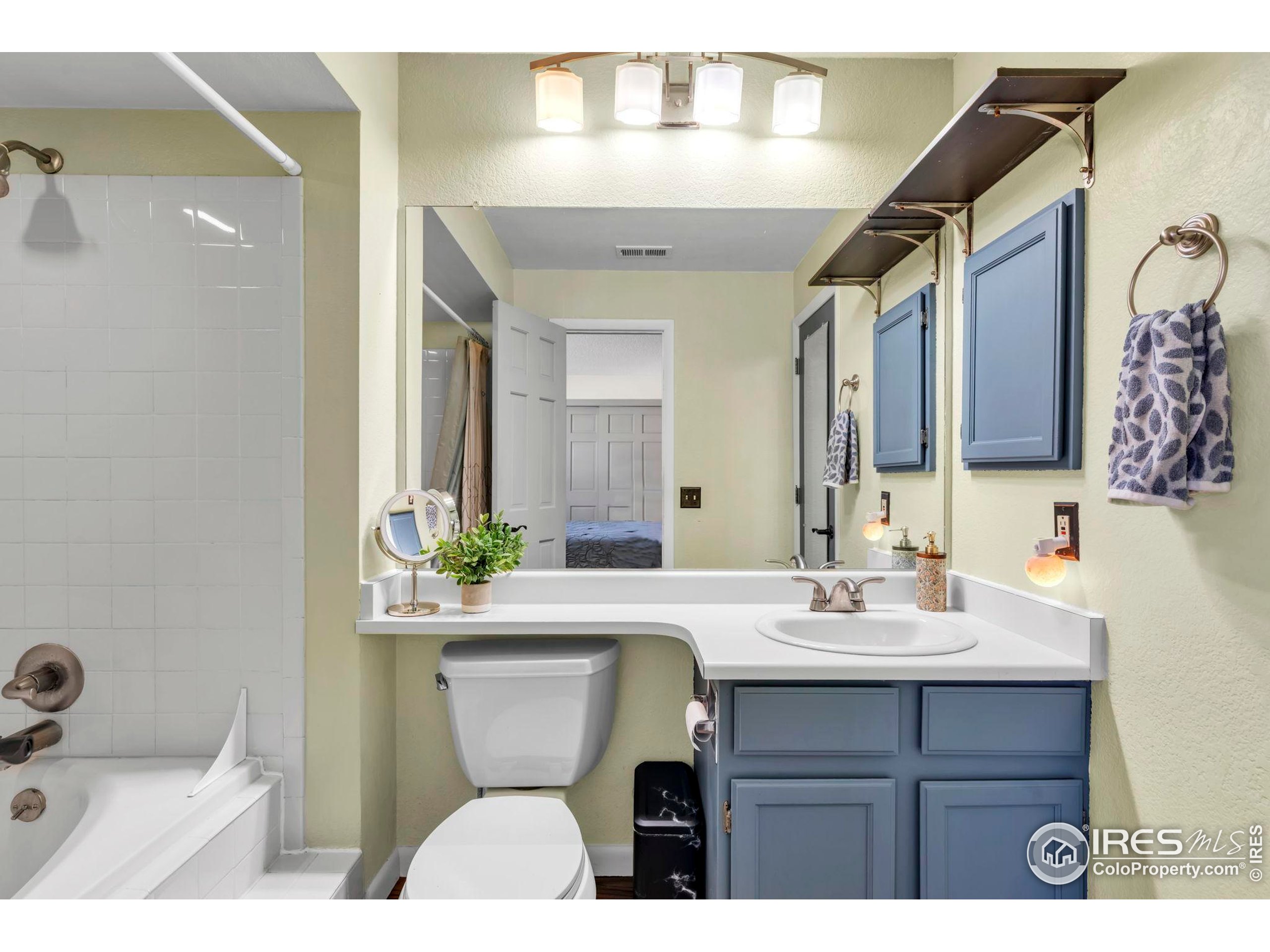 5914 Gunbarrel Avenue, Unit F Boulder, CO 80301 - Photo 10 of 25 a bathroom with a sink and a mirror