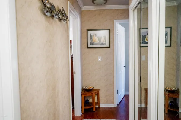 a view of a hallway with a hallway and a livingroom
