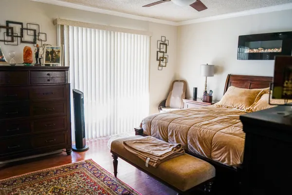 a bedroom with a bed and cabinets