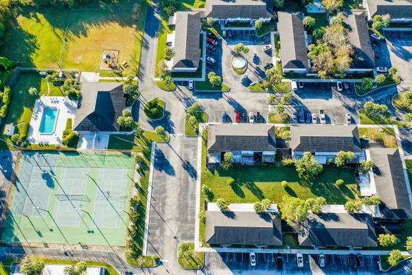 an aerial view of a residential houses with city view