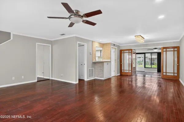 a kitchen with stainless steel appliances granite countertop a refrigerator sink and microwave