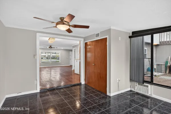 a view of an empty room with a window