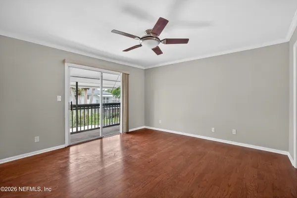 an empty room with wooden floor