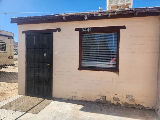 a kitchen with cabinets and white appliances