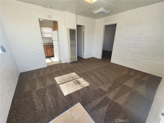 a kitchen with a sink stove and refrigerator