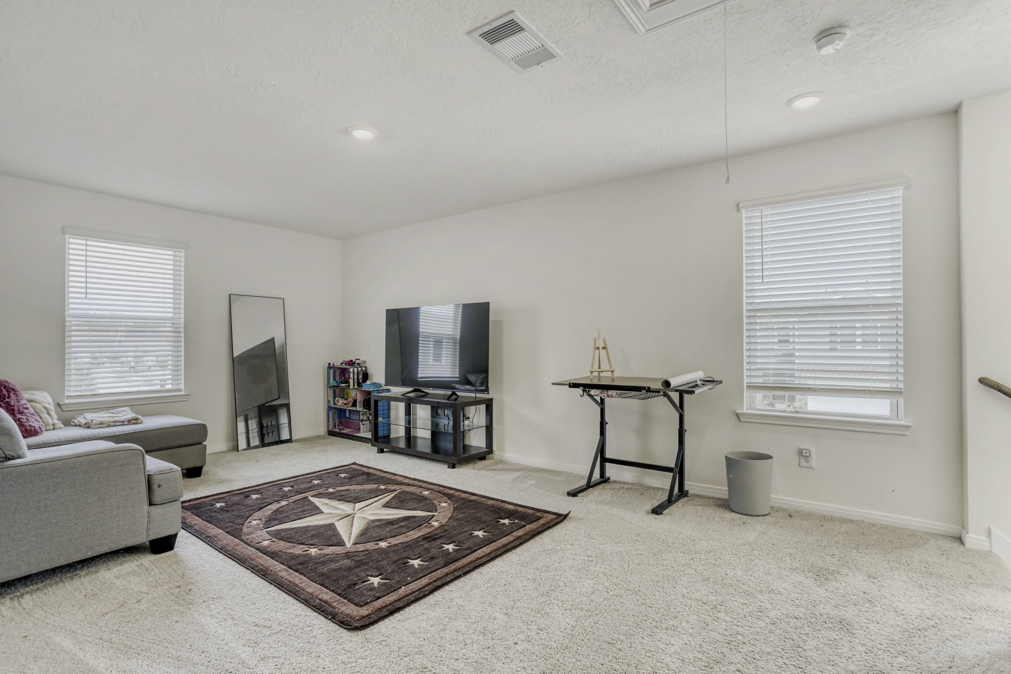 3331 Forest Chitto Dr Spring Spring, TX 77373 - Photo 14 of 29 Upstairs you have a spacious loft perfect for relaxation, entertainment, or a play area for your family.