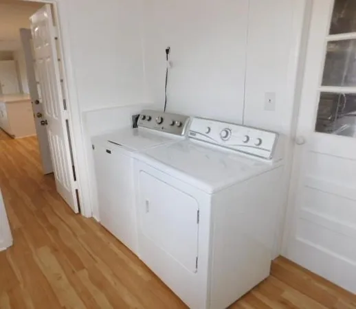 a utility room with dryer and washer