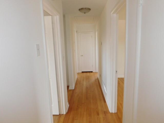 2407 Summerland Drive Decatur, GA 30032 - Photo 13 of 22 a view of a hallway with wooden floor and staircase