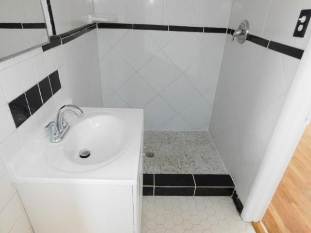 2407 Summerland Drive Decatur, GA 30032 - Photo 19 of 22 a bathroom with a shower and a sink