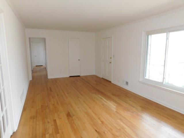 2407 Summerland Drive Decatur, GA 30032 - Photo 5 of 22 a big room with wooden floor and windows in a room