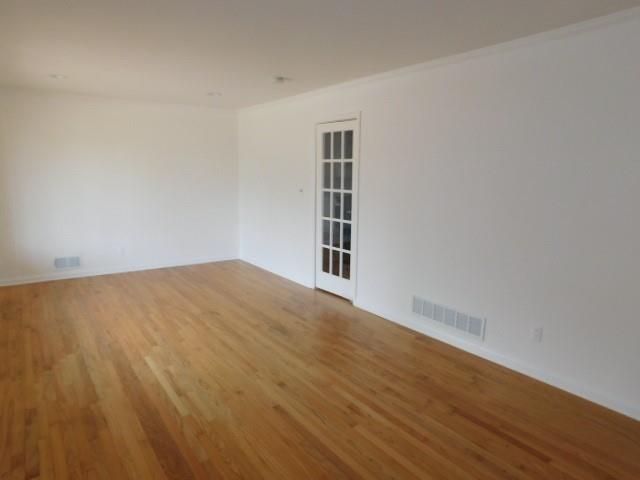 2407 Summerland Drive Decatur, GA 30032 - Photo 6 of 22 a view of empty room with wooden floor