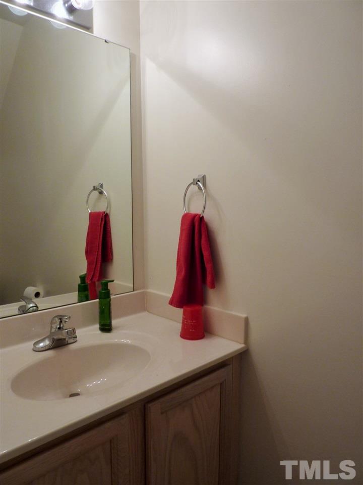 22 Red Lane Raleigh, NC 27606 - Photo 6 of 7 a bathroom with a sink and a mirror