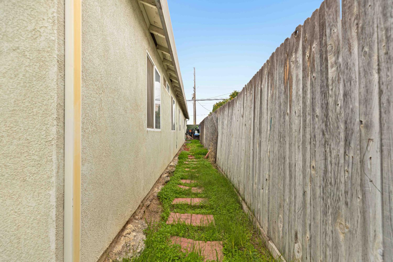 310 West F Street Turlock, CA 95380 - Photo 21 of 27 a view of a pathway of a wooden fence