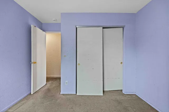 an empty room with closet