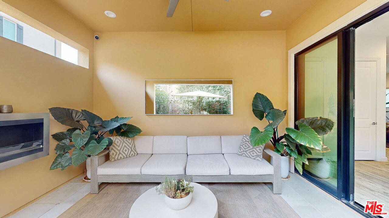 20607 West Chestnut Circle Porter Ranch, CA 91326 - Photo 11 of 52 a living room with furniture and a potted plant